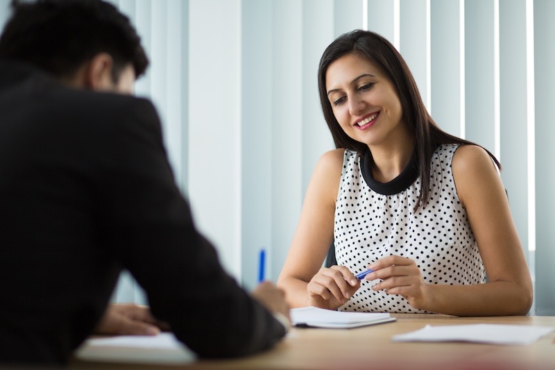 A woman passing an interviewing and joining an organization.